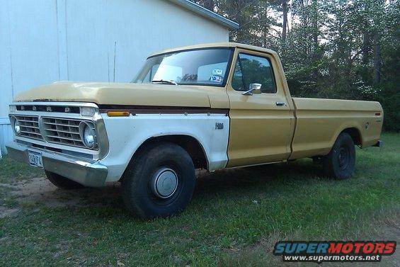 Yellow and white Ford F-100 pickup truck, front quarter view