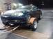 2003 Hyundai Tiburon - This dark blue 2003 Hyundai Tiburon is seen being transported on a trailer.