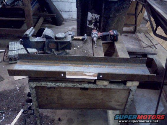 Workbench with vise, hammer, and drill