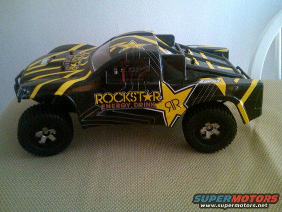 Black remote control trophy truck with yellow Rockstar Energy Drink graphics