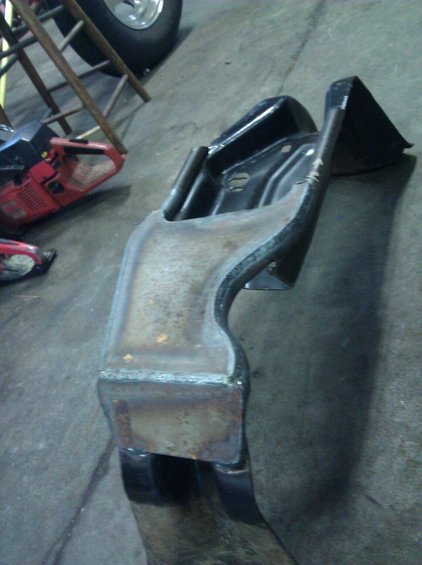 Welded metal bracket with visible weld seams and black coating