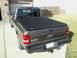 2011 Ford Ranger - Rear view of a dark gray Ford Ranger pickup truck equipped with a black tonneau cover.