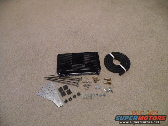 black oil cooler with hose and mounting hardware