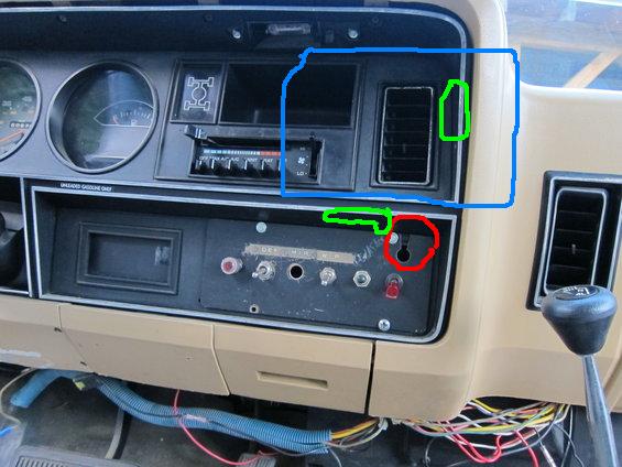 Dashboard interior showing radio, climate controls, vents, and switches