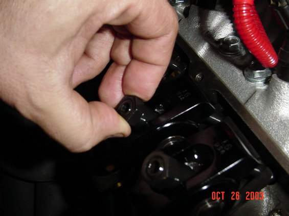 valve-adjustment-065.jpg Tighten the nut just enough to touch the pushrod so it wont move,