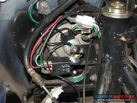 Close-up of motorcycle wiring harness, relay, and connectors