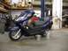 2008 Yamaha Zuma - A dark blue scooter is parked in a workshop, showing a sticker with the number '213'.