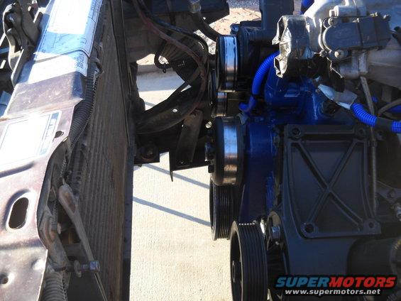 Close-up of engine pulleys and radiator assembly