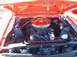 1995 Ford Crown Victoria - The engine bay of a classic car is shown with an orange paint scheme and a V8 engine.