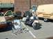 1995 Ford Crown Victoria - A collection of law enforcement vehicles and trophies are displayed outdoors, possibly at an event.