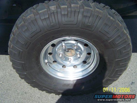 Close-up of a large off-road tire and chrome rim