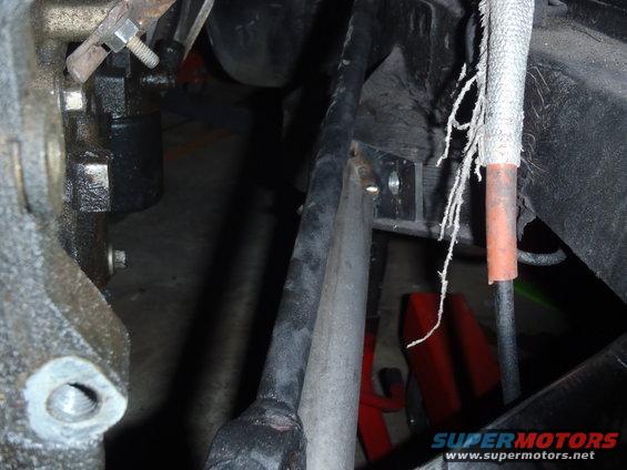 Engine bay detail with hoses and metal components