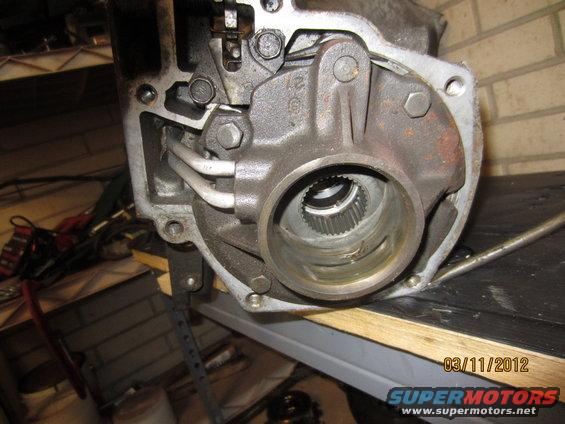 Close-up of a transmission component with splines visible inside a housing