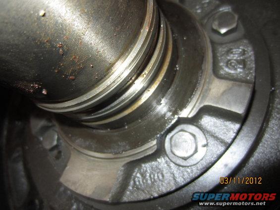 Close-up of a metal part with date stamp 03/11/2012
