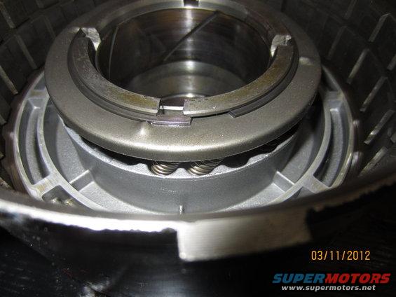 Close-up of a transmission clutch pack with springs and metal plates