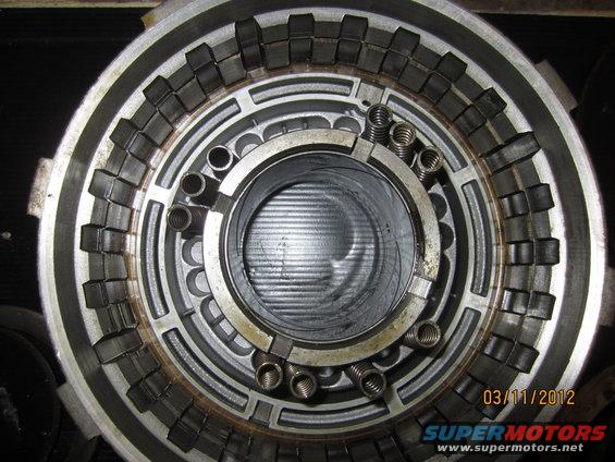 Close-up of an automatic transmission clutch pack with springs and friction plates