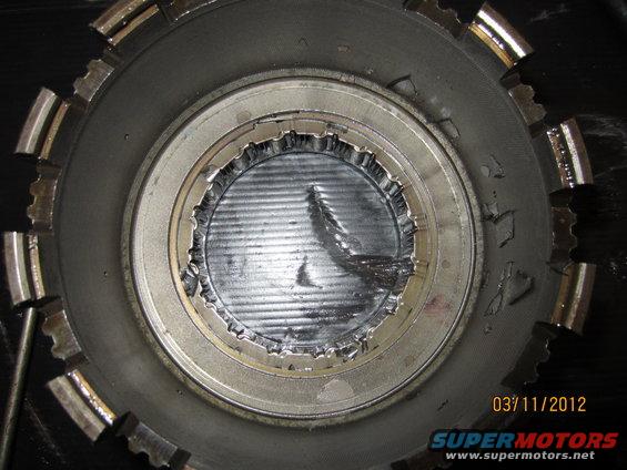 Damaged transmission clutch pack with torn metal