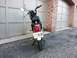 1999 Tomos Targa - Moped with a New Jersey license plate parked in front of a garage.