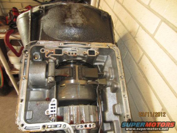 Open automatic transmission showing torque converter and internal components. Date stamp reads 03/11/2012