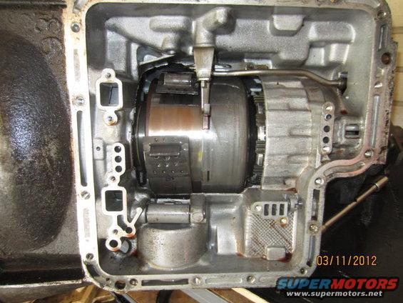 Open automatic transmission housing showing torque converter and gears