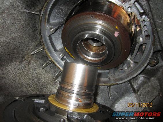 Close-up of a transmission torque converter and pump assembly, showing internal components and wear