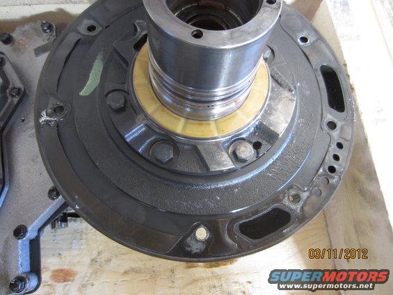 Transmission pump housing with a yellow seal and metal shaft
