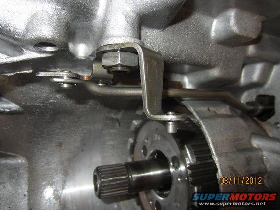 Close-up of transmission linkage and gears inside a vehicle's transmission housing
