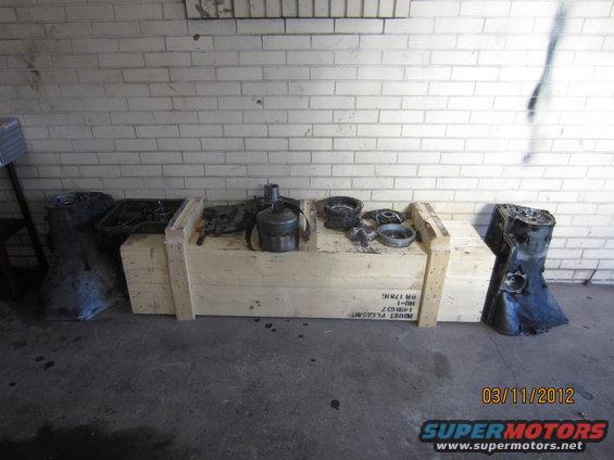 Transmission housing and components on wooden crates