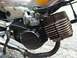 1999 Tomos Targa - Close-up of a Tomos moped engine, showing the carburetor and exhaust system.