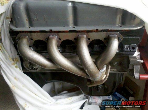 Engine block with custom headers installed