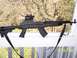 1989 Ford Bronco - A Chinese Paratrooper SKS rifle with an aftermarket stock and optic is displayed outdoors.