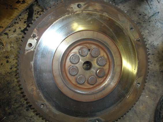 Flywheel with gear teeth and bolt pattern