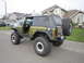 1974 Ford Bronco - This modified 1974 Ford Bronco is seen from a rear three-quarter angle on a suburban street.