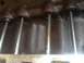 1992 Ford Bronco - Close-up view of engine pushrods within a dark, oily block, suggesting internal engine work.