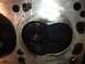 1992 Ford Bronco - Close-up of an engine cylinder head, revealing internal components and signs of use.
