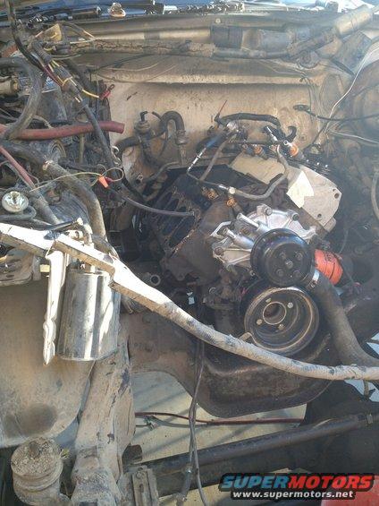 Engine bay with visible engine parts and wiring