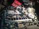 1992 Ford Bronco - Close-up of engine components, including a carburetor and distributor, with a toolbox nearby.