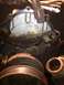 1992 Ford Bronco - Close-up of a corroded engine water pump housing, showing signs of wear and potential leaks.