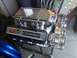 1992 Ford Bronco - A highly polished Chevrolet engine, identified as a 502, is displayed on a stand.