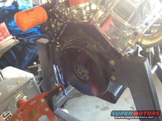 Engine block with chrome valve covers and an orange Fram oil filter attached