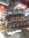 1992 Ford Bronco - Close-up view of an engine's internal components during a rebuild, with tools and supplies visible.