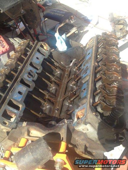 Engine block with valve covers removed, showing internal components