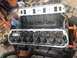 1992 Ford Bronco - Close-up view of an engine block with the valve covers removed, revealing the internal valve train components.