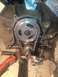 1992 Ford Bronco - Close-up of an engine's timing chain and gears, likely during a rebuild or repair process.
