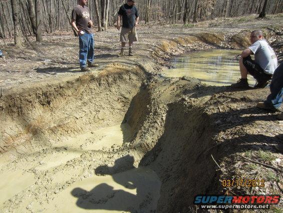 Muddy off-road course with people watching, dated 03/17/2012
