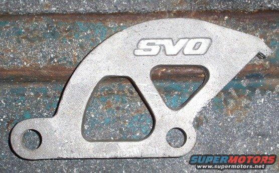 Metal bracket with SVO logo, on a rusty surface