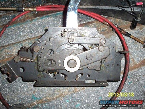 Automatic transmission shifter mechanism with red cables and metal levers