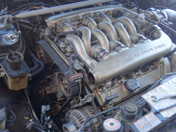 Close-up of a SHO 3.0L V6 engine with 24 valve DOHC labeling on the intake manifold