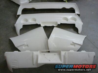 White Corvette body kit parts including bumpers and fenders