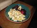 1990 Ford Bronco - A close-up view of a bowl filled with various fruits and nuts, set against a wooden surface.